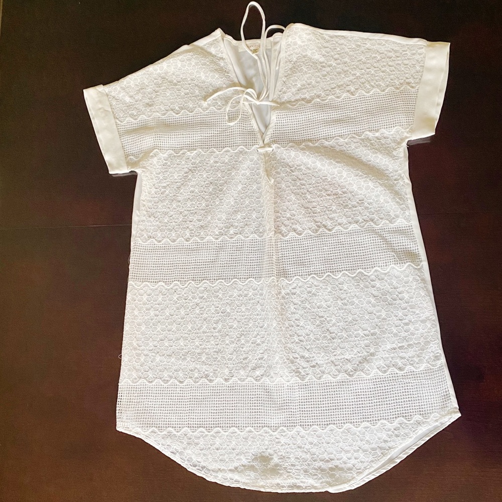 Francesca’s white swimsuit coverup.